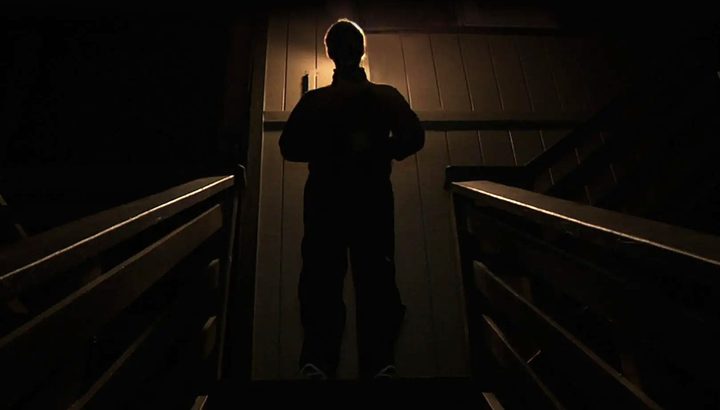 A man stands in shadow in 2014's Creep.