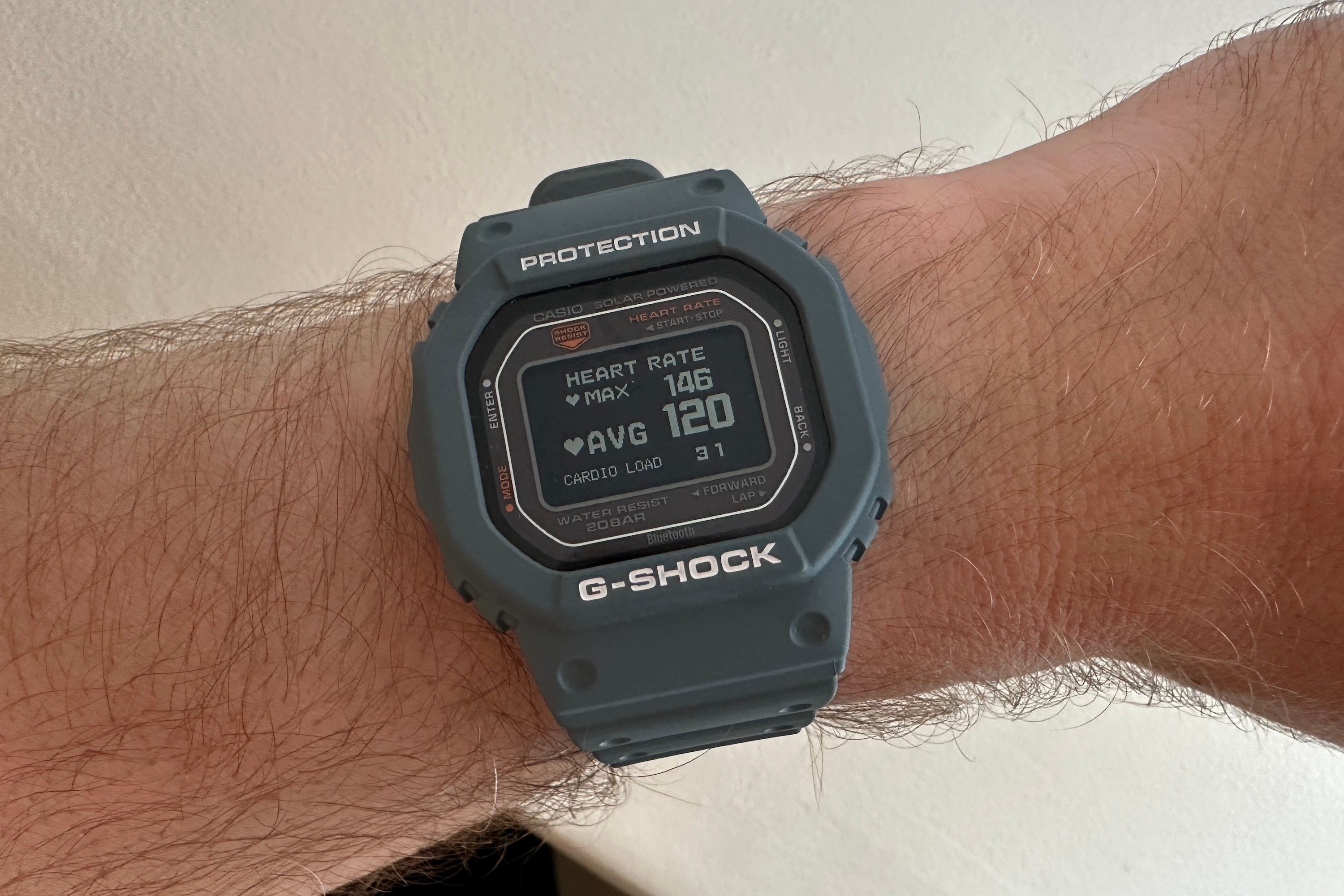 A person wearing the Casio G-Shock DW-H5600, showing workout heart rate data.