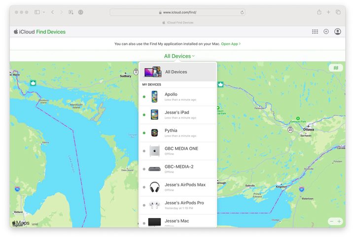 Apple's Find My Devices website showing a list of devices against a background map.