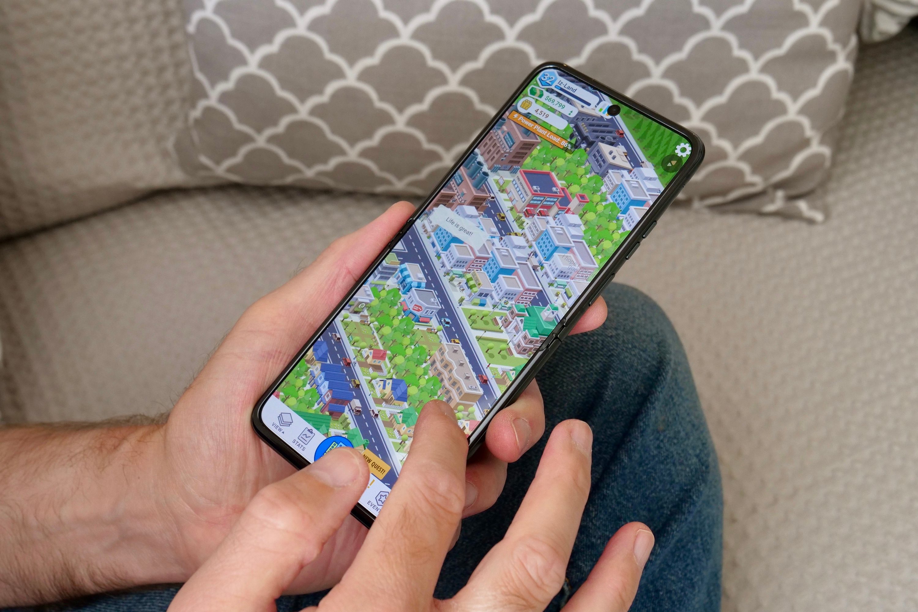 A person playing a game on the Motorola Razr 40.
