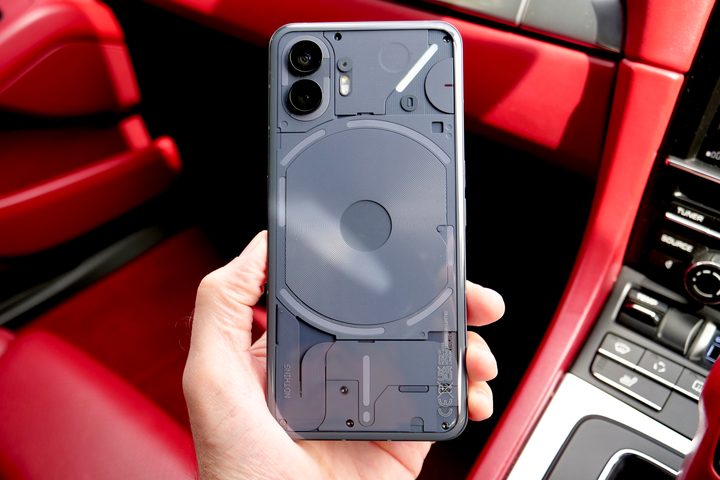 A person holding the Nothing Phone 2.