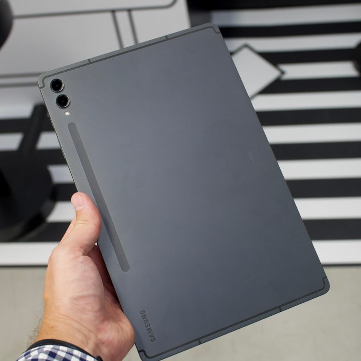 Someone holding the Samsung Galaxy Tab S9 Plus.
