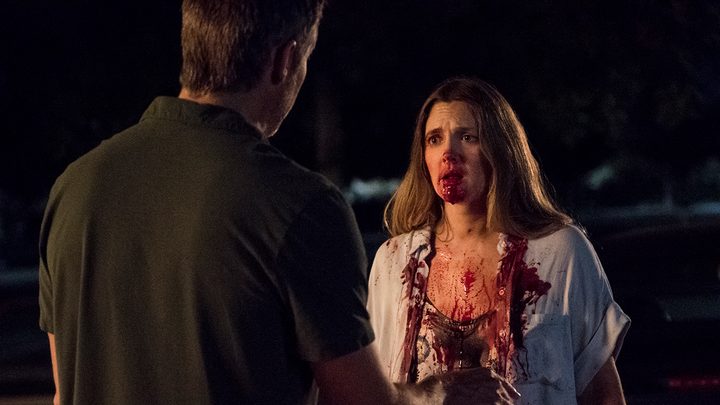 Drew Barrymore in Santa Clarita Diet, her mouth covered in blood, looking terrified.