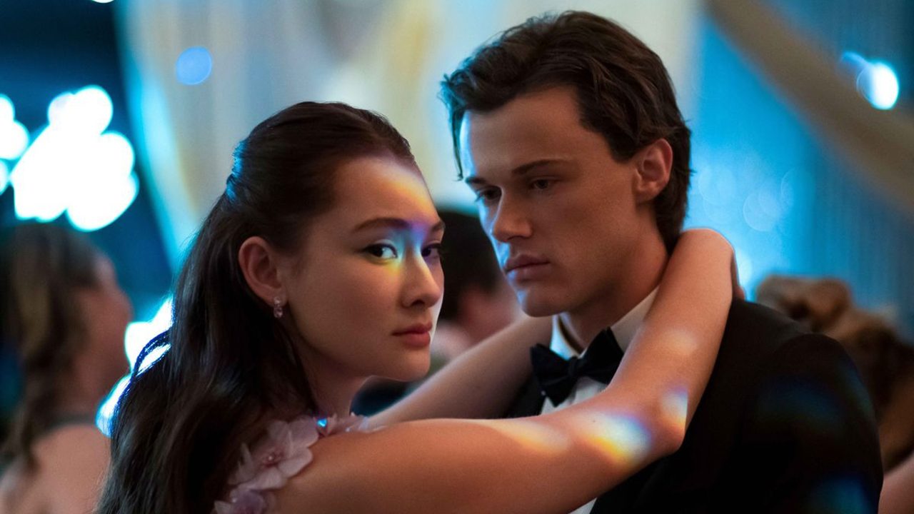 A young woman and man dancing, the woman looking off to the side in a scene from The Summer In Turned Pretty.