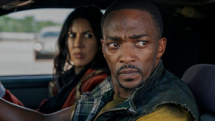 John Doe and Quiet in the car looking at something in a scene from Twisted Metal.