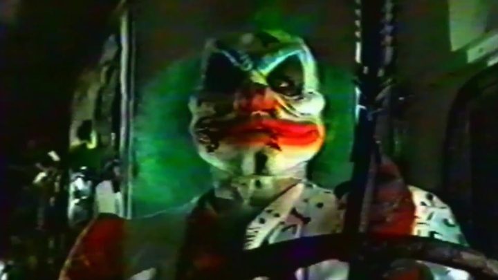 Sweet Tooth holds a gun in a live action twisted Metal ending.