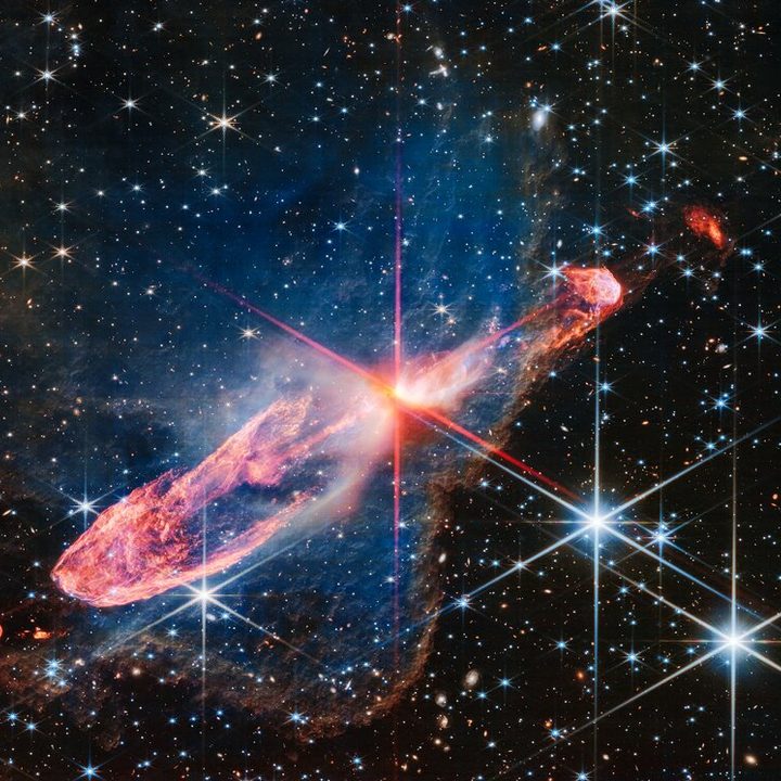 A high-resolution image of a tightly bound pair of actively forming stars, known as Herbig-Haro 46/47, in near-infrared light.
