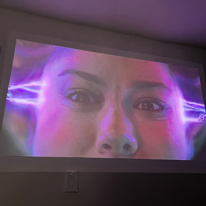 The image from the Xgimi Mo-Go 2 Pro featuring Captain Marvel in a room with some ambient light.