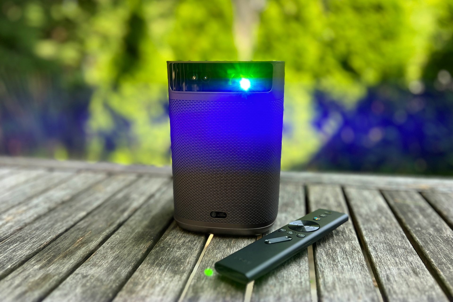 The MoGo 2 Pro projector with the lamp shining from the land.