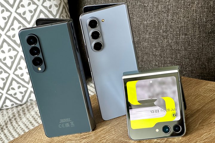 Samsung Galaxy Z Fold 5, Galaxy Z Fold 4, and Galaxy Z Flip 5 standing upright on a table.