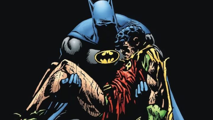 Batman holding Robin