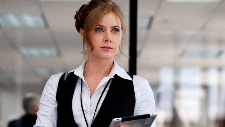 Amy Adams as Lois Lane in an office in Man of Steel.