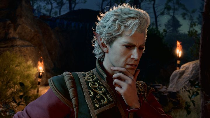 Astarion looking pensive with his hand resting on his chin
