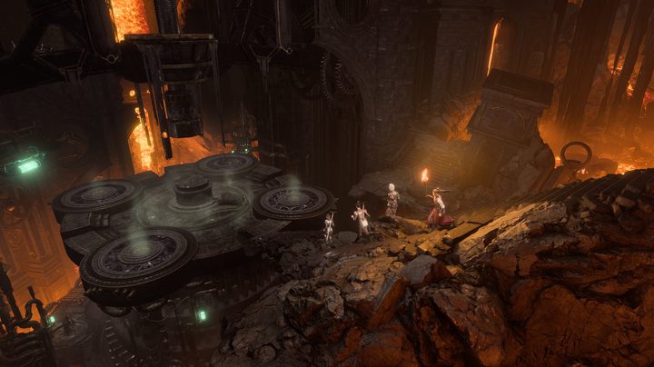 Four adventurers exploring a cave with a torch.