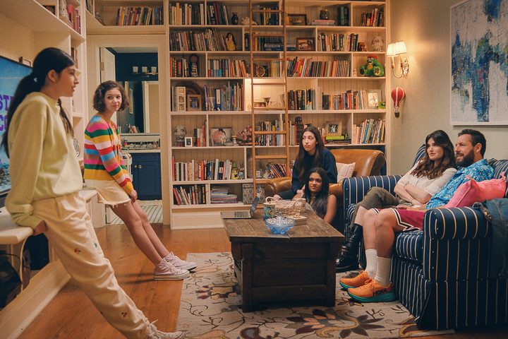 A family talks around the living room table in You Are So Not Invited To My Bat Mitzvah.