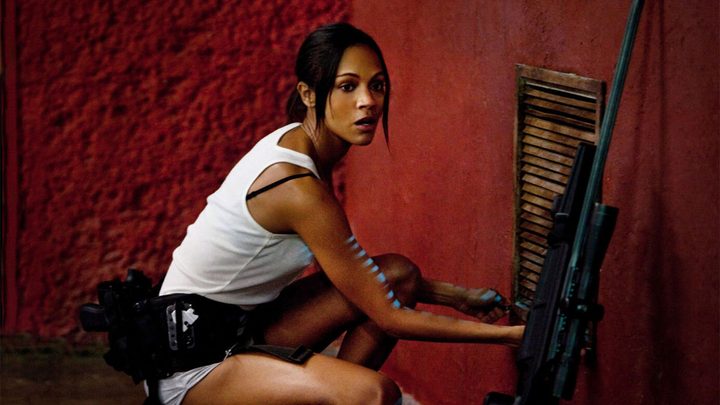 Zoe Saldana holds a gun in Columbiana.