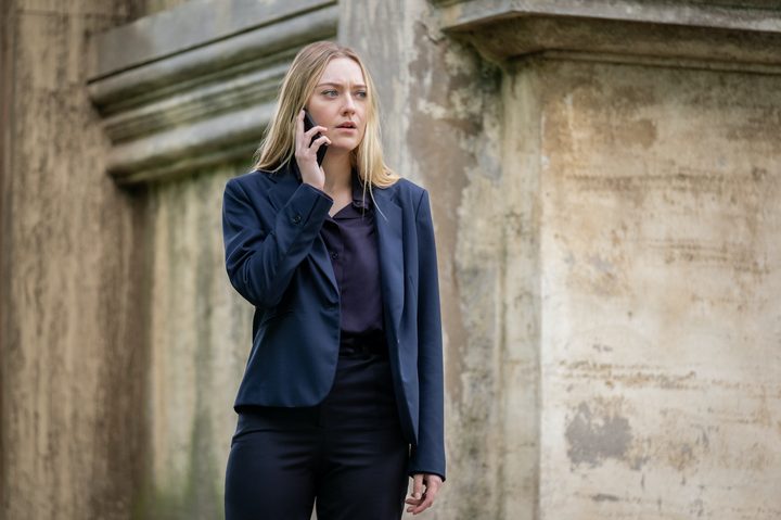 Dakota Fanning holds a phone to her ear in The Equalizer 3.
