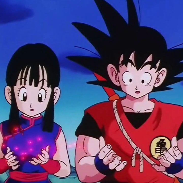A boy and girl stand next to each other with hands out in Dragon Ball.