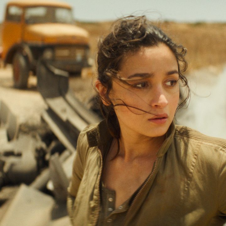 A woman stands in the desert in Heart of Stone.