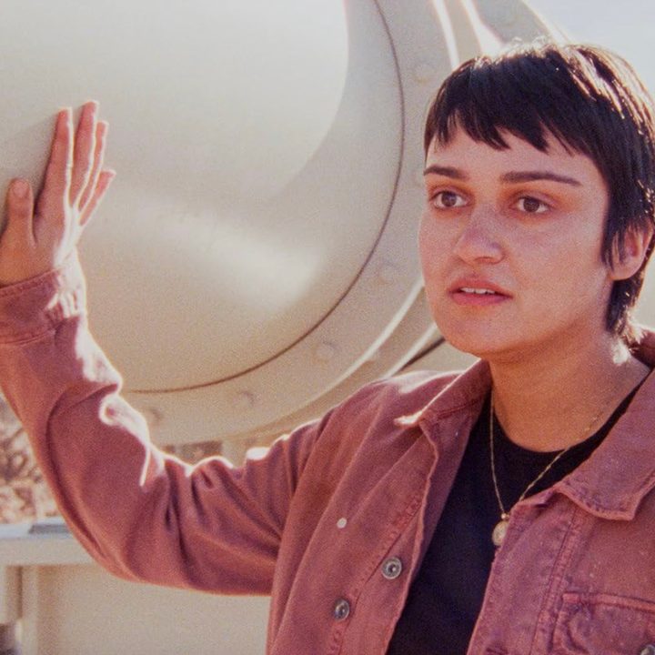 A woman touches a pipeline in How to Blow Up a Pipeline.
