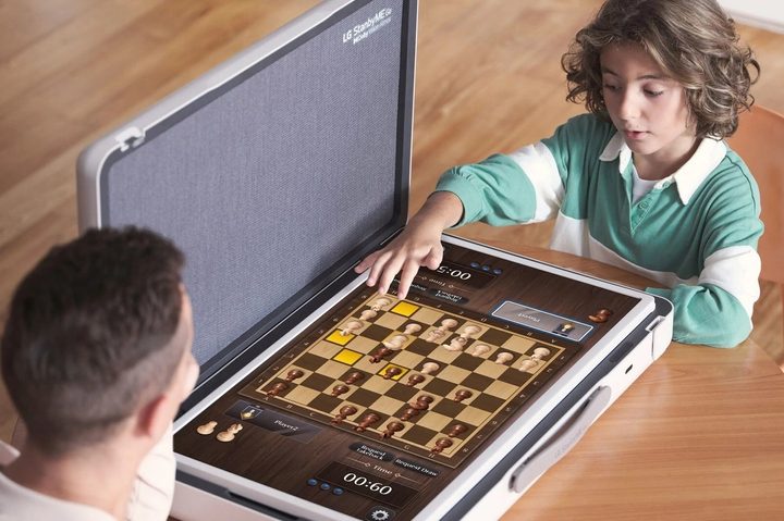 LG StanbyMe Go 27-inch touchscreen suitcase TV playing a board game.