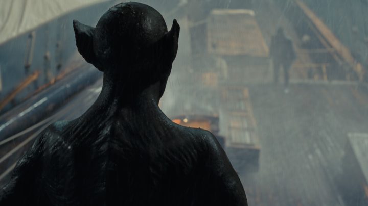 Dracula surveys his prey from above the deck of the ship in a still from the movie Last Voyage of the Demeter