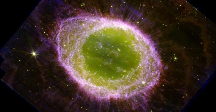 JWST/NIRcam composite image of the Ring Nebula. The images clearly show the main ring, surrounded by a faint halo and with many delicate structures. The interior of the ring is filled with hot gas. The star which ejected all this material is visible at the very centre. It is extremely hot, with a temperature in excess of 100,000 degrees. The nebula was ejected only about 4000 years ago. Technical details: The image was obtained with JWST's NIRCam instrument on August 4, 2022. Images in three different filters were combined to create this composite image: F212N (blue); F300M (green); and F335M (red).