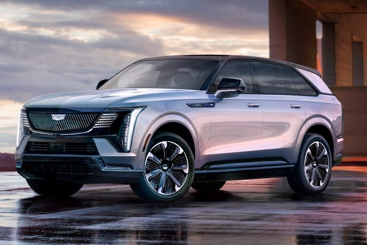 The 2025 Cadillac Escalade IQ against a cloudy backdrop.
