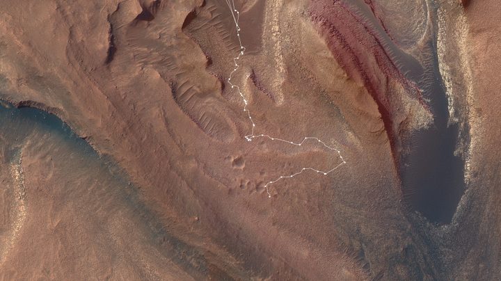 This map shows the route NASA’s Curiosity Mars rover took from May into July to complete the most difficult climb of the mission. Starting in “Marker Band Valley” (the darker area at the top center), the route is shown in white, with dots indicating each stop the rover made.