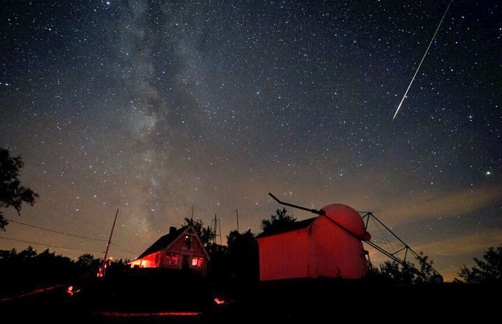 A bright Perseid meteor streaked down on August 7, 2010, over buildings at the Stellafane amateur astronomy convention in Springfield, Vermont.