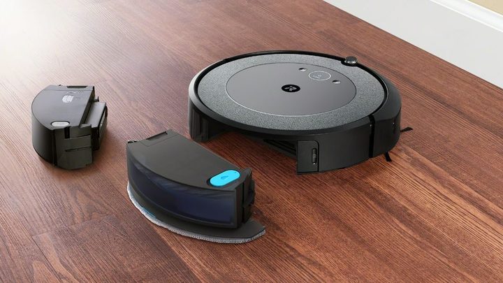 The Roomba Combo i5+ next to its different bins.