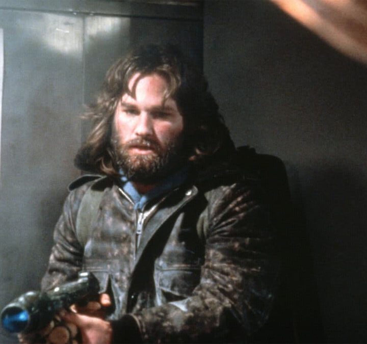 Kurt Russell points a flamethrower in "The Thing."