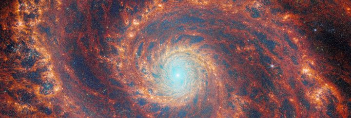 The graceful winding arms of the grand-design spiral galaxy M51 stretch across this image from the NASA/ESA/CSA James Webb Space Telescope. Unlike the menagerie of weird and wonderful spiral galaxies with ragged or disrupted spiral arms, grand-design spiral galaxies boast prominent, well-developed spiral arms like the ones showcased in this image. This galactic portrait is a composite image that integrates data from Webb’s Near-InfraRed Camera (NIRCam) and Mid-InfraRed Instrument (MIRI).