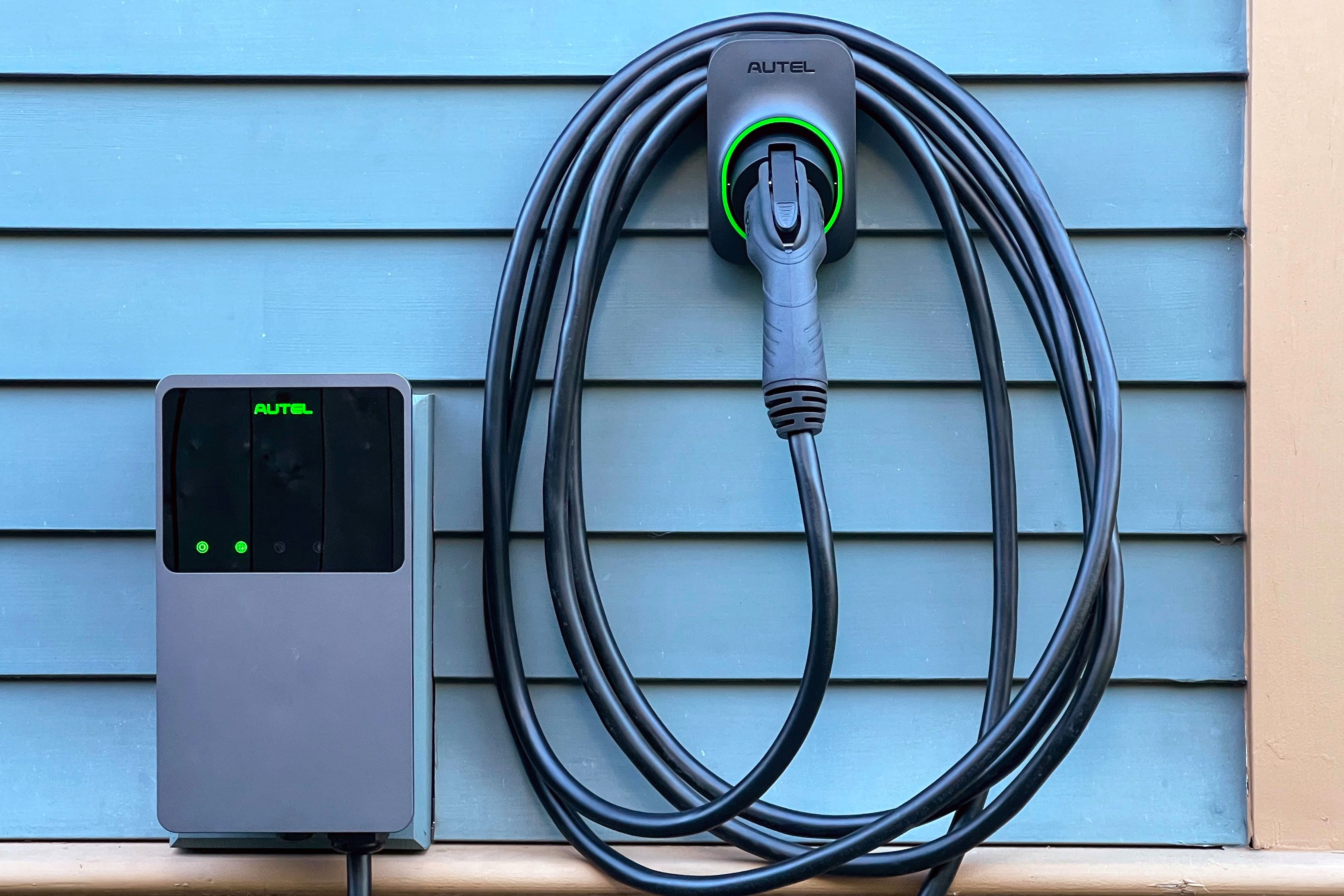 Electric vehicle connected to a home charging station during an EV charger installation in Austell, GA