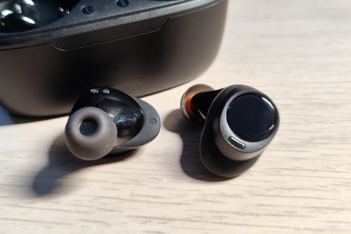 Baseus Bowie MA10 left and right earbuds in front of open charging case.