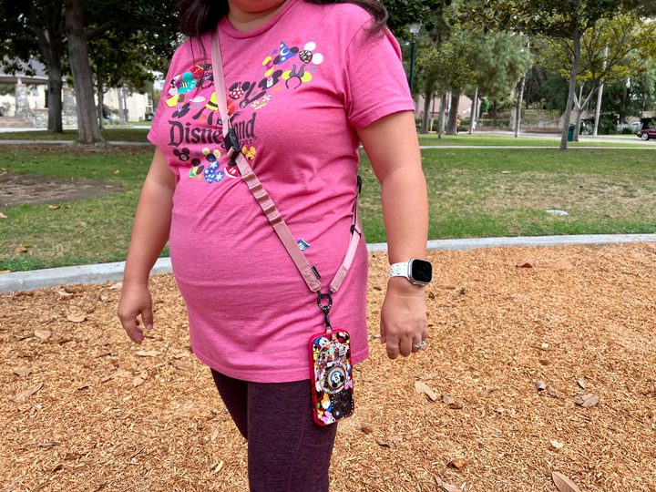 Casetify's Utility Crossbody Lanyard strap being worn.