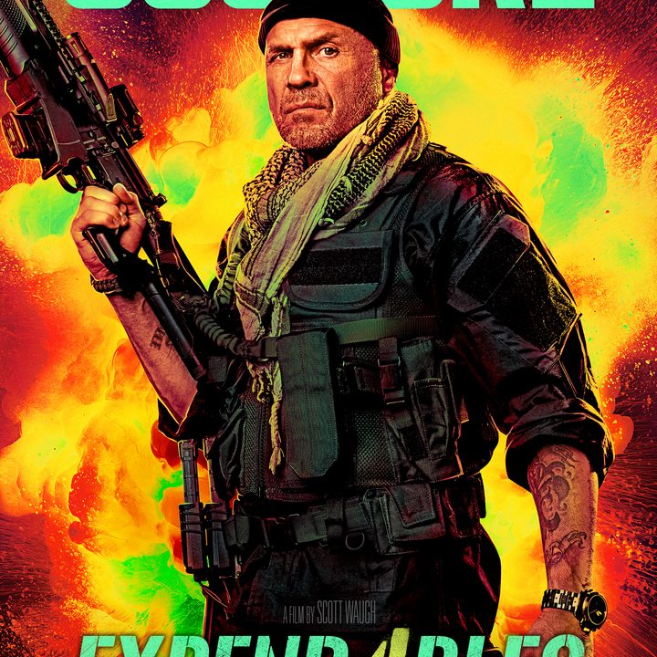 Randy Couture points his gun on Expend4bles poster.