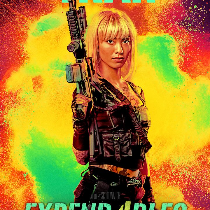 Levy Tran points gun to sky on Expend4bles poster.