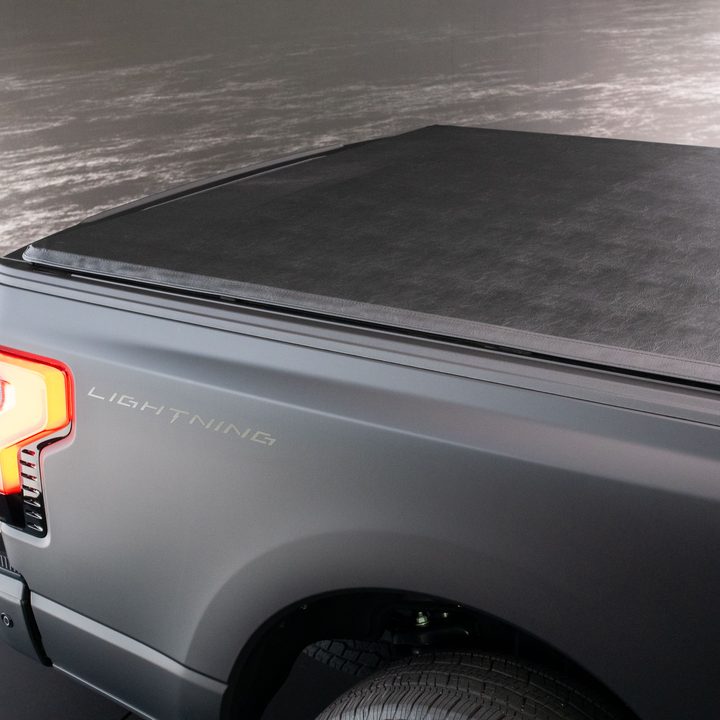 An F-150 Lightning Platinum Black model rear tonneau cover.