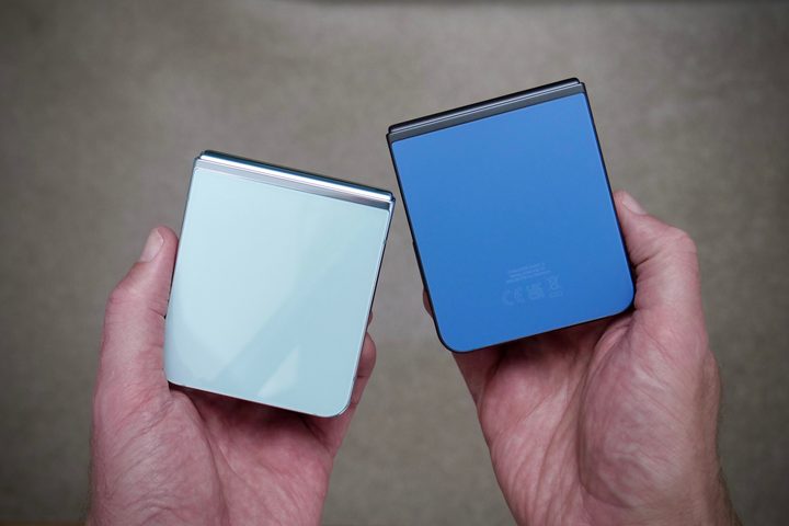 A person holding the Samsung Galaxy Z Flip 5 in Mint and blue colors.