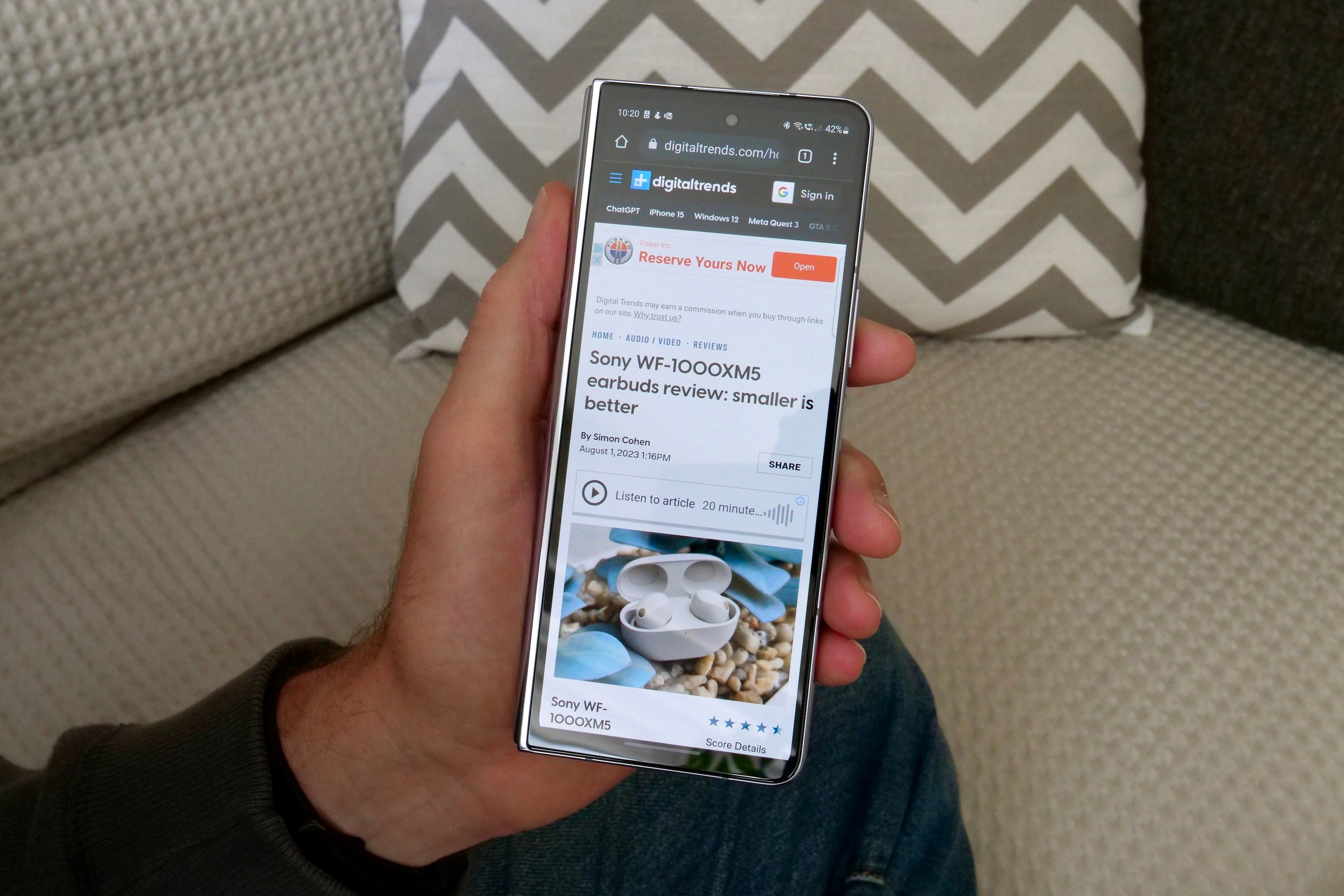 Reading a webpage on the Samsung Galaxy Z Fold 5's cover screen.