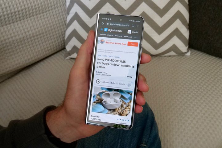 Reading a webpage on the Samsung Galaxy Z Fold 5's cover screen.