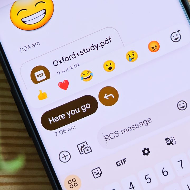 Emoji reactions on Google Messages running on OnePlus 11.