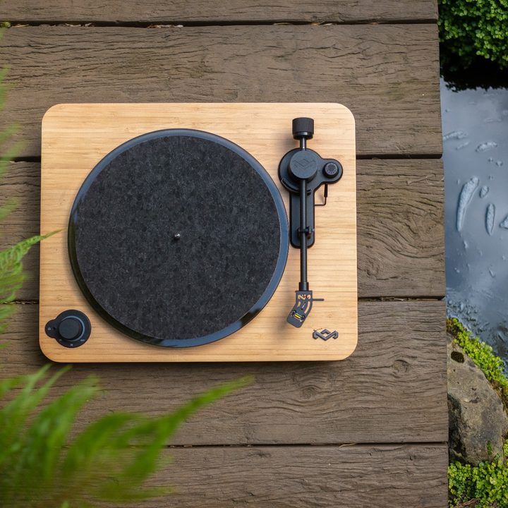 The House of Marley Stir It Up Lux turntable on a wooded platform.