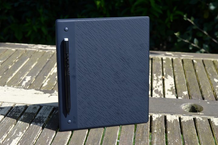 The Kobo Elipsa 2E stood up on a table outside.