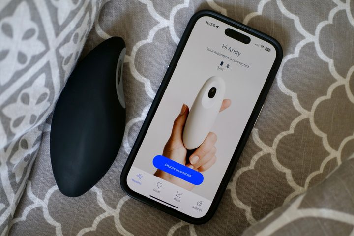 The Moonbird device, resting on a pillow, with the app running on an iPhone 14 Pro.