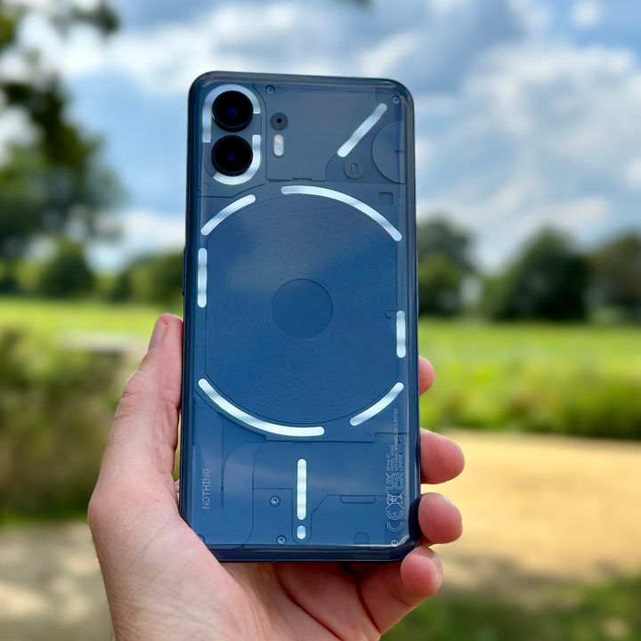 A person holding the Nothing Phone 2.