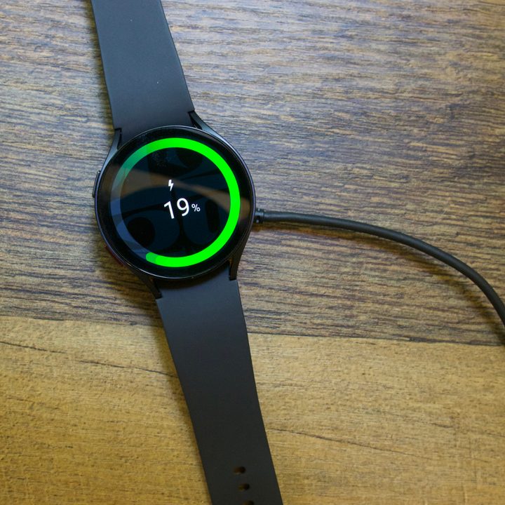 Samsung Galaxy Watch 6 on its charger.