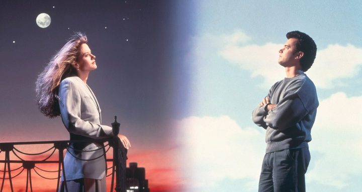 A man and a woman look at each other in Sleepless in Seattle.