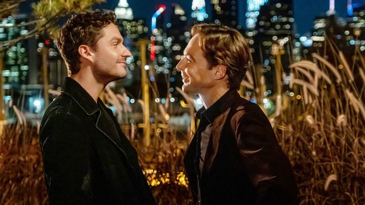 A man smiles at another man at night in Spoiler Alert.
